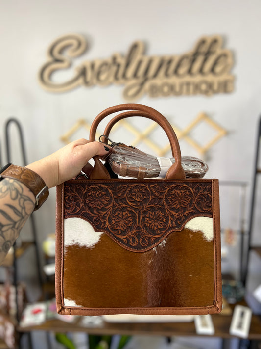 Trinity ranch hair on cowhide floral tooled concealed carry